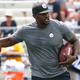 Pittsburgh Steelers senior defensive assistant Brian Flores works with the defense as they go through drills during practice at NFL football training camp in Latrobe, Pa., Monday, Aug. 8, 2022. The Steelers hired Flores as a senior defensive assistant in the offseason, not long after Flores filed a class action lawsuit against the NFL and several teams alleging racist hiring practices.